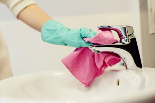 Cleaner preparing equipment safely before starting work