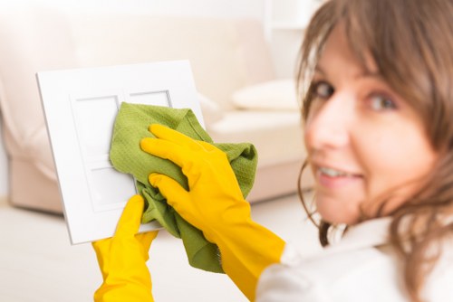 Cleaning a building facade in Maidavale with professional equipment